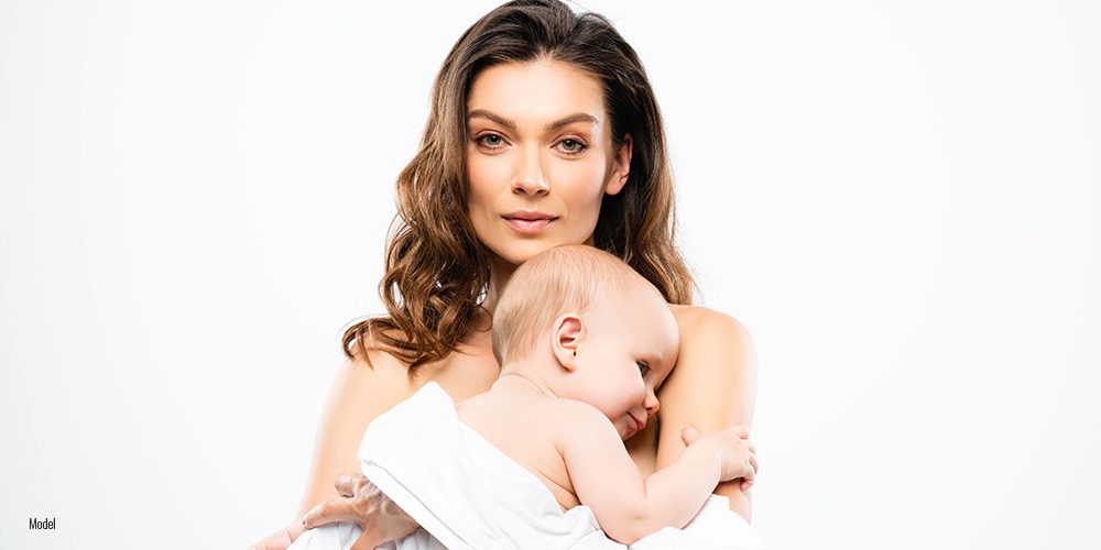 Baby and mom on white background